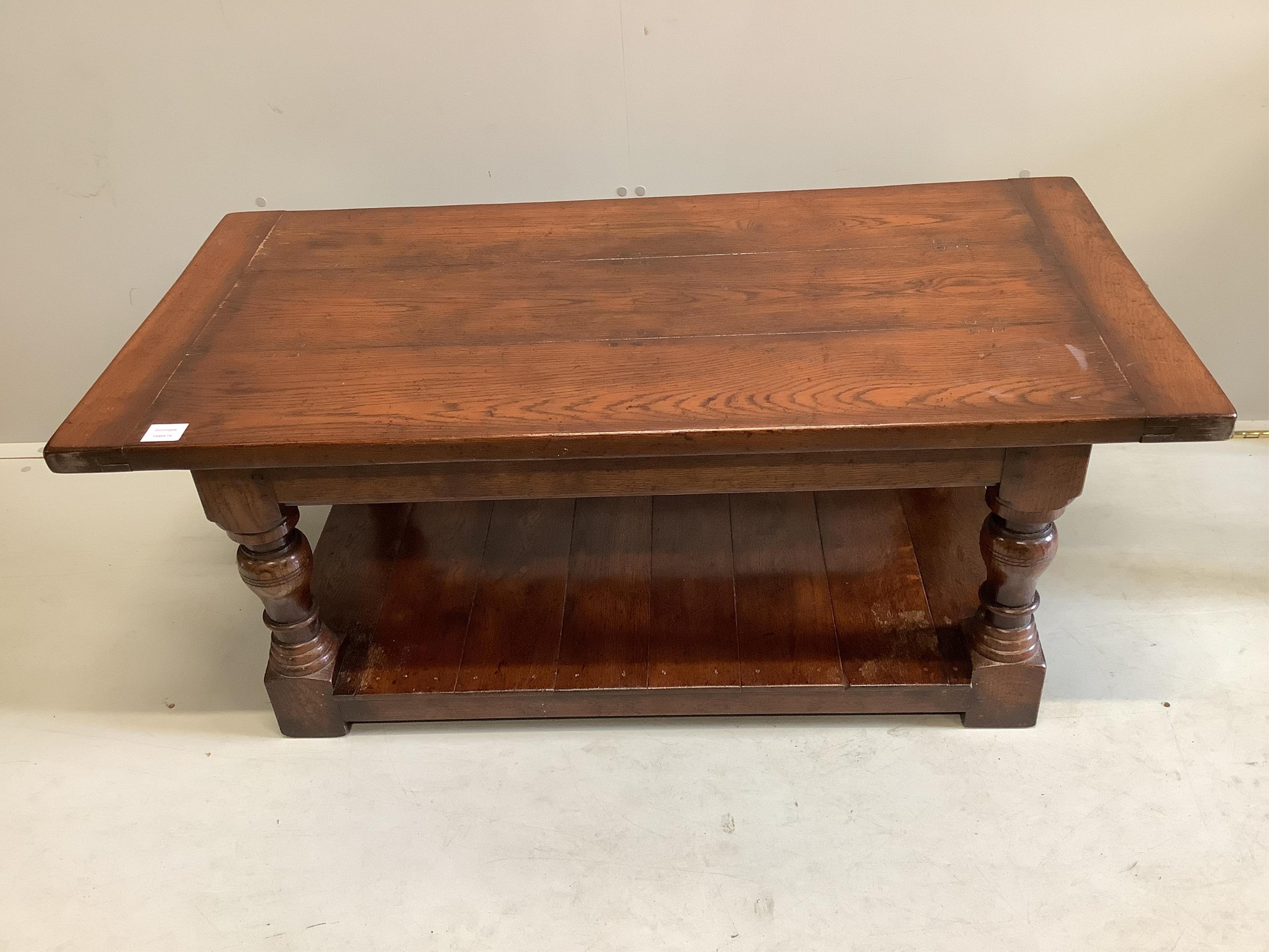 An 18th century style rectangular oak two tier coffee table, width 121cm, depth 61cm, height 49cm. Condition - fair